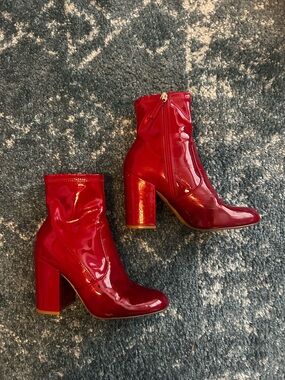 Steve Madden red high heeled boots